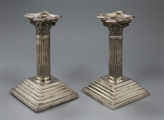 A pair of late Victorian silver corinthian column dwarf candlesticks by Joseph Cook & Son, Birmingham, 1900, 16cm.